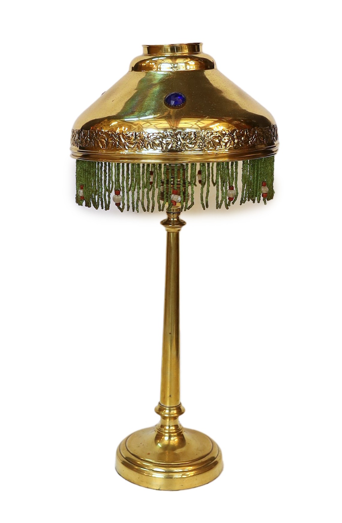 An early 20th century English brass table lamp, the jewelled shade with glass bead fringe, height 45cm